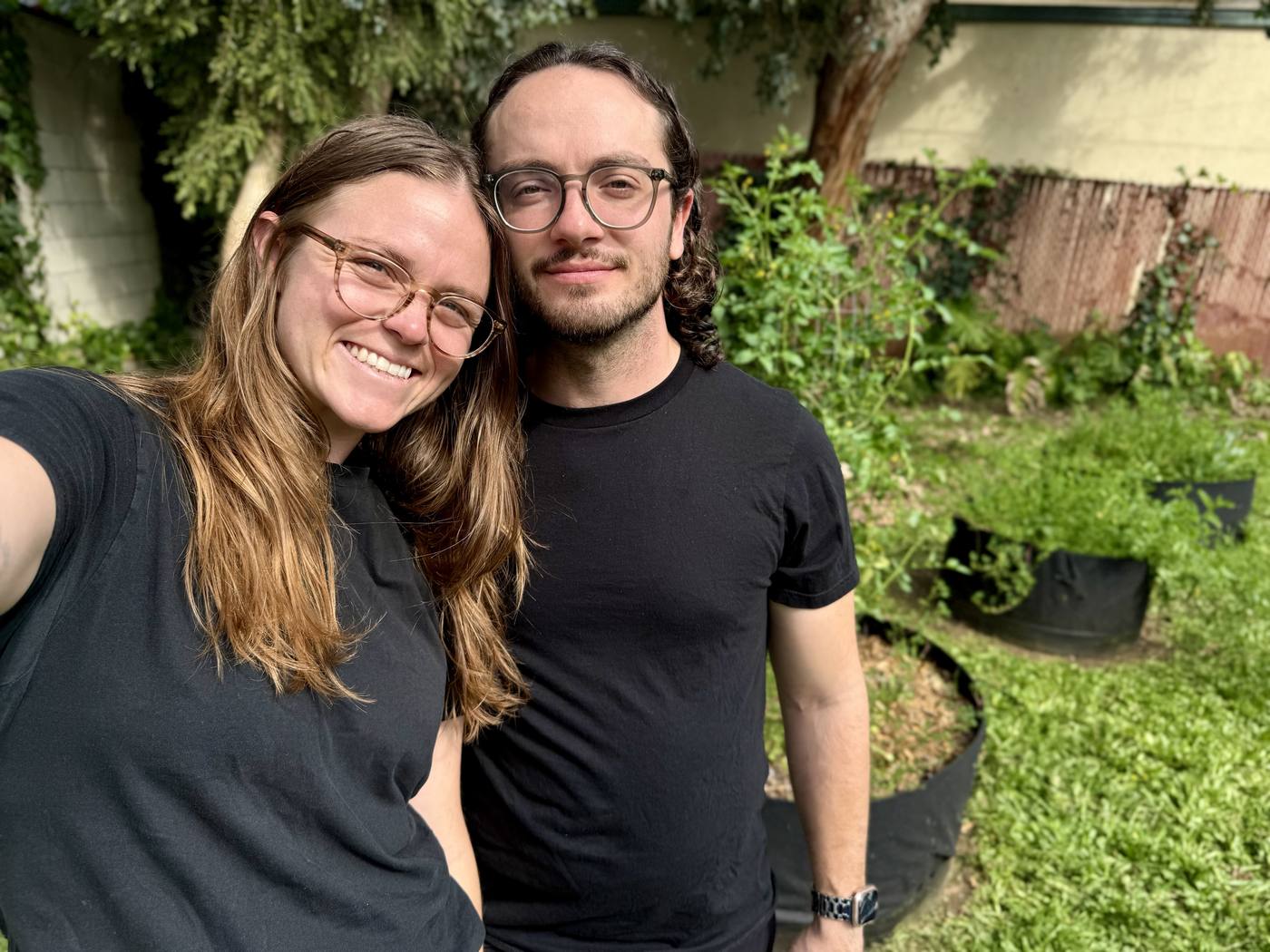 Natalie and Noah smiling together in the garden