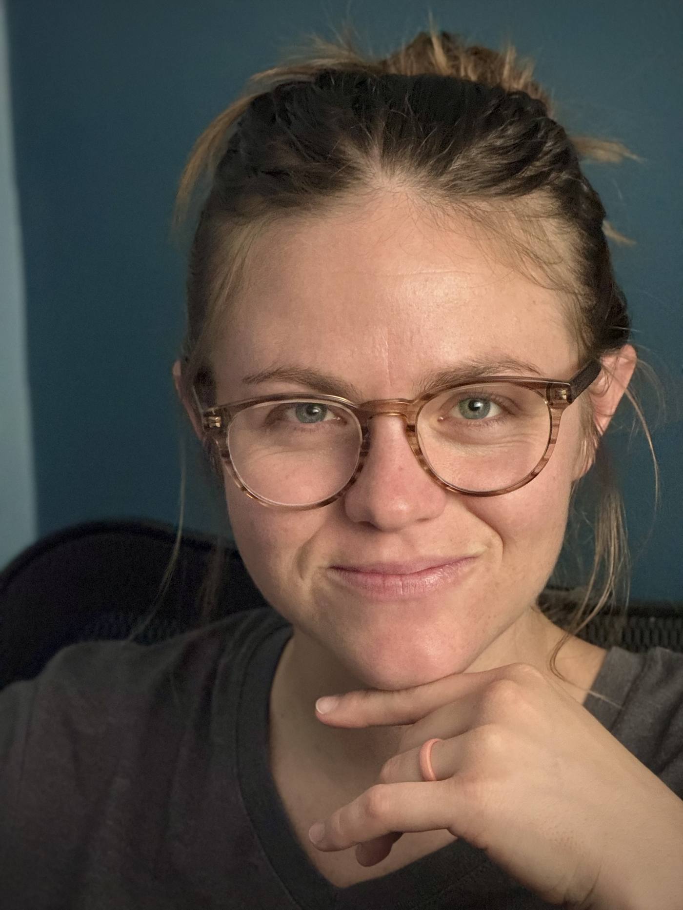 Natalie Zelezny at her desk, thinking