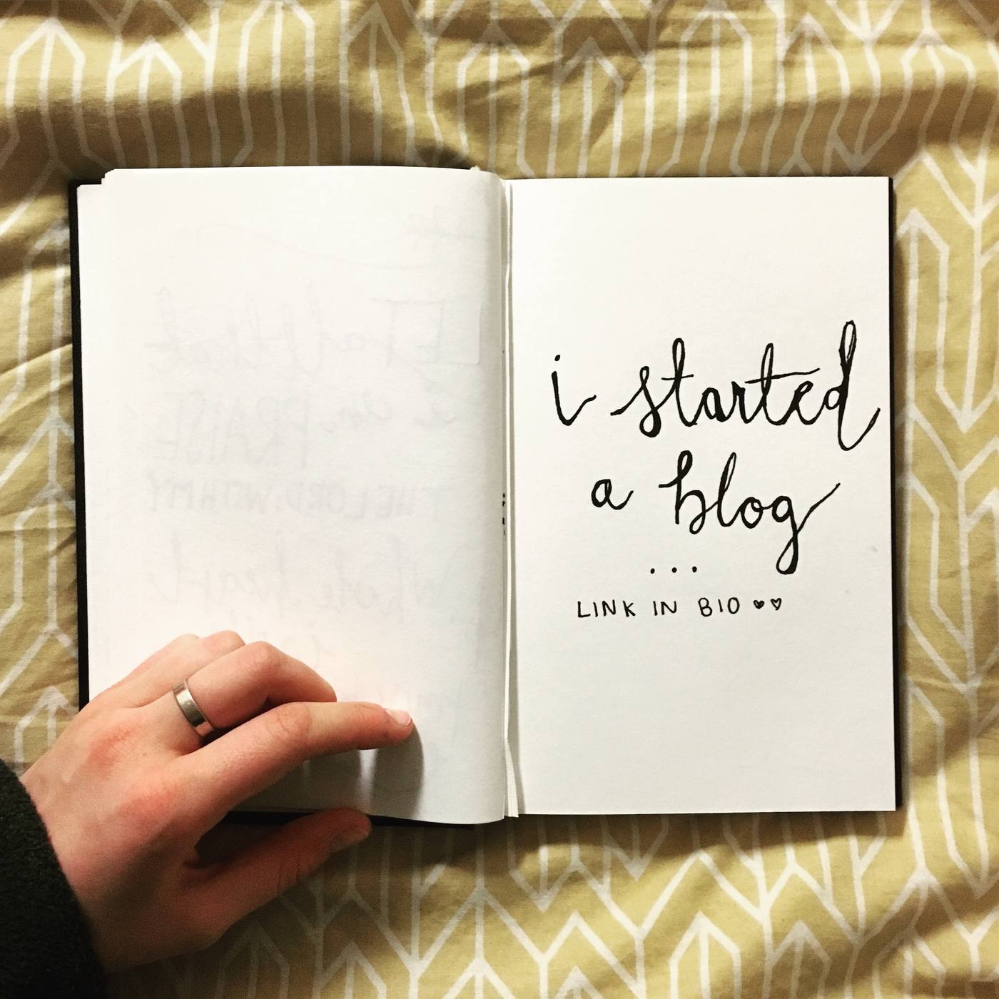 Hand-lettered journal page reading 'i started a blog... link in bio' — the aesthetic college era attempt that never launched